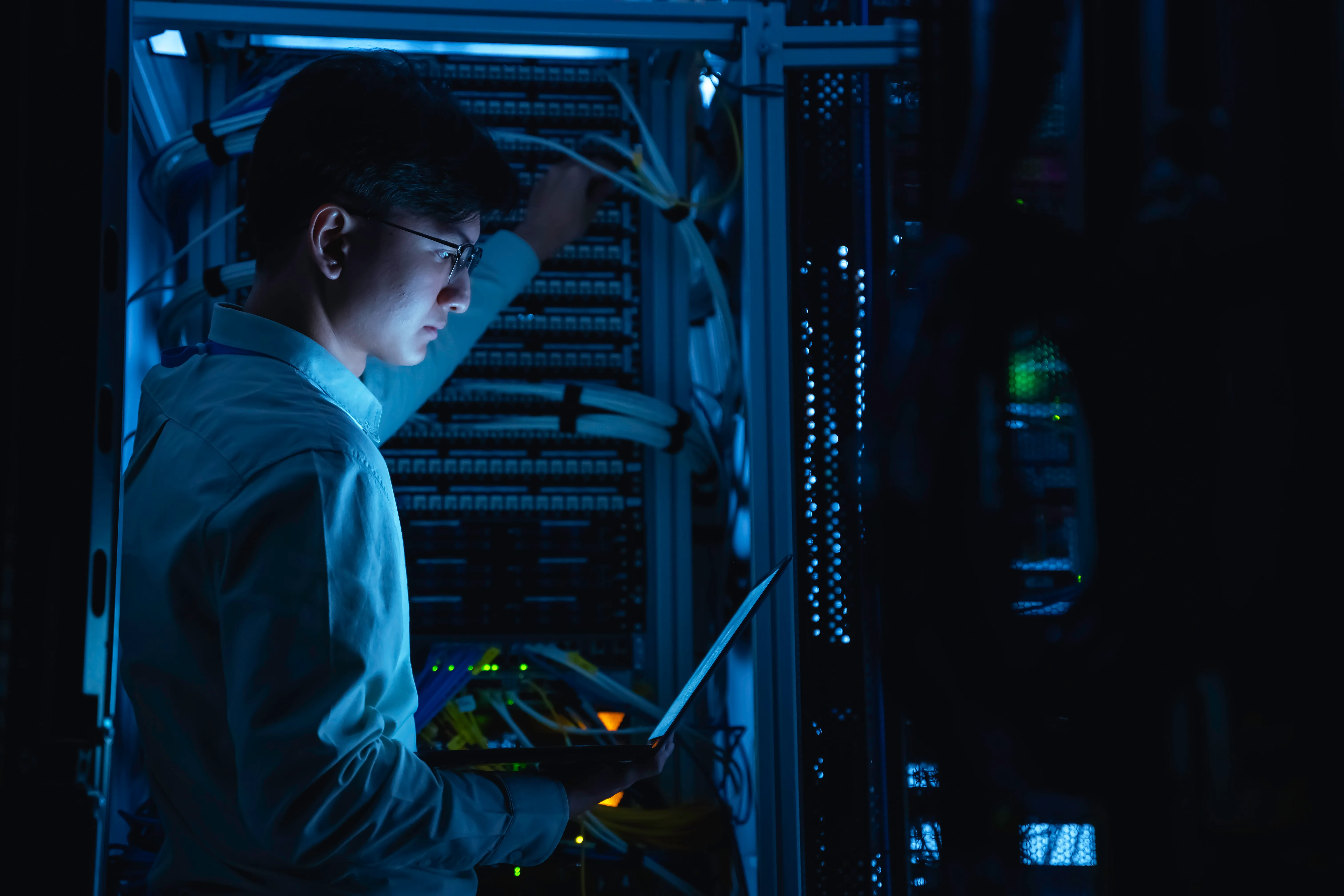 Datacenter engineer working on server rack